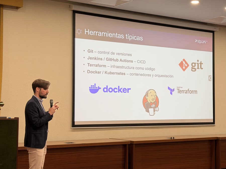 David Fernández Rodríguez presenting a slide on typical DevOps tools during his Try It! UPM talk